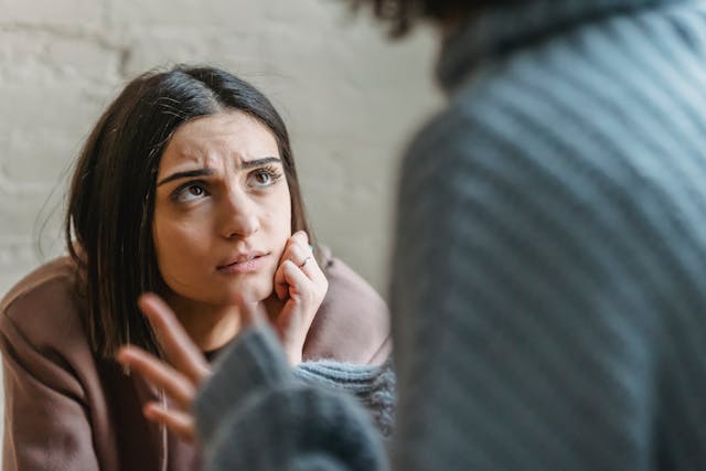 Two women having an intense conversation