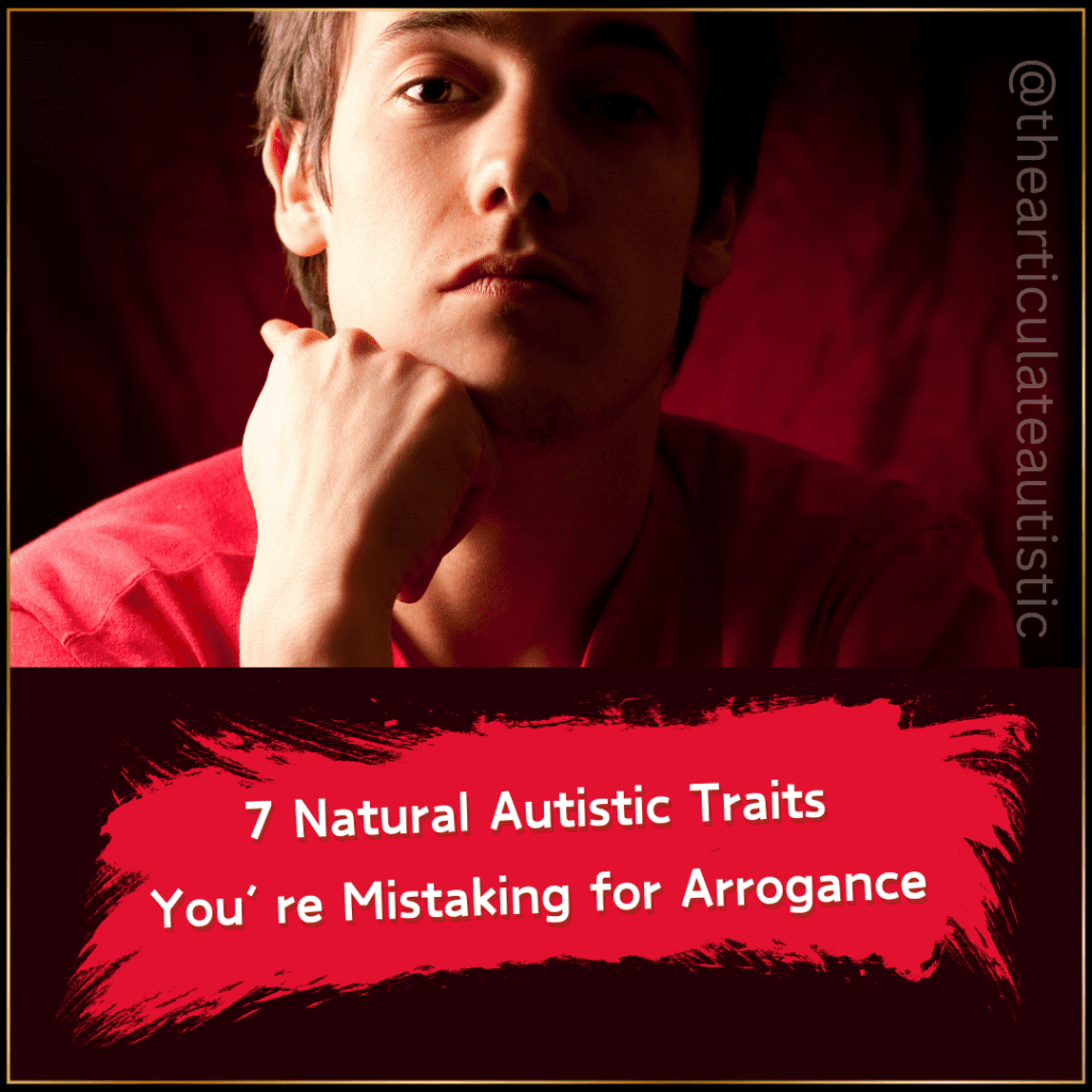 Close-up photo of a young man in a red shirt sitting in front of a textured red background. He is resting his hand on his chin while gazing into the camera with an intense facial expression. 